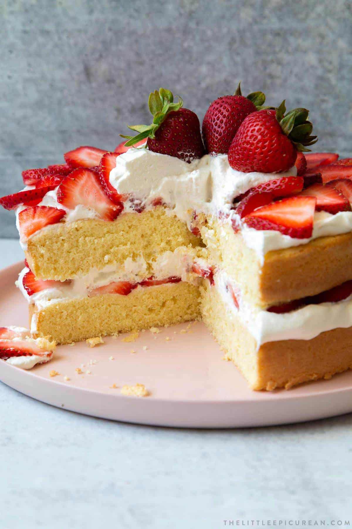 sliced strawberry sponge layer cake