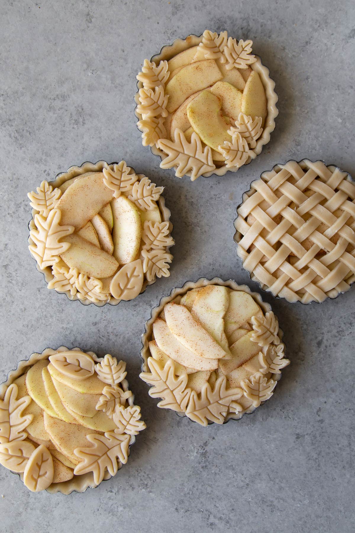 mini apple pie tarts decorated in four various ways.