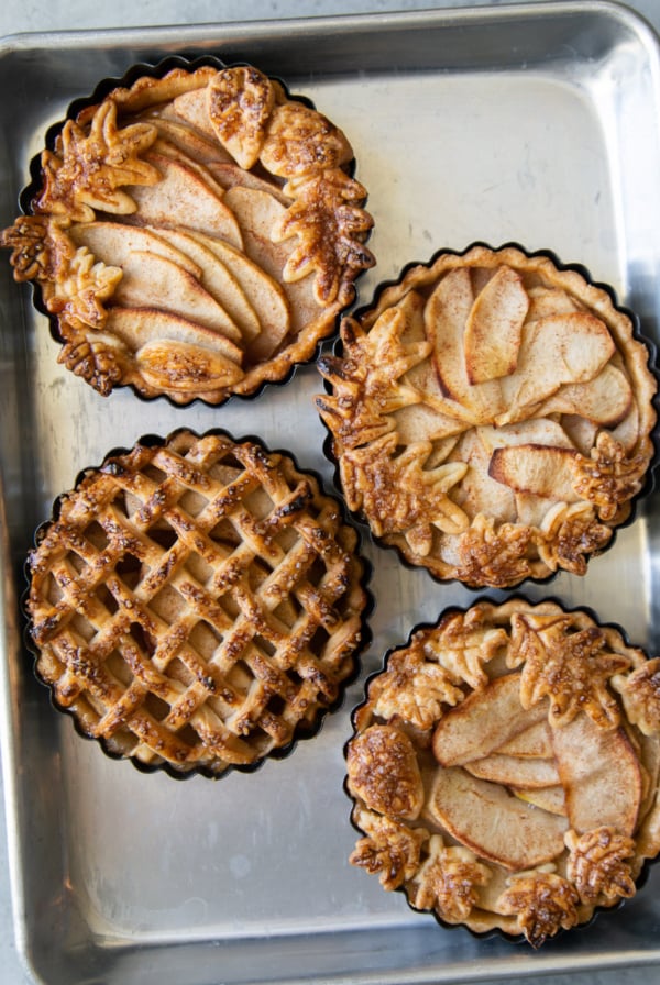 mini apple pie tarts decorated in four various ways.