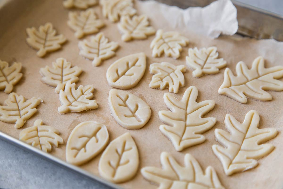 use small cookie stamps to punch out pie dough decorations. 