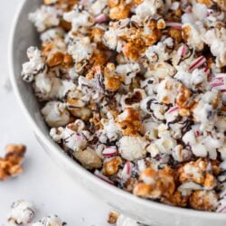 Peppermint bark popcorn in white bowl