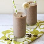 chocolate peanut butter banana smoothie with espresso in glasses with paper straws.