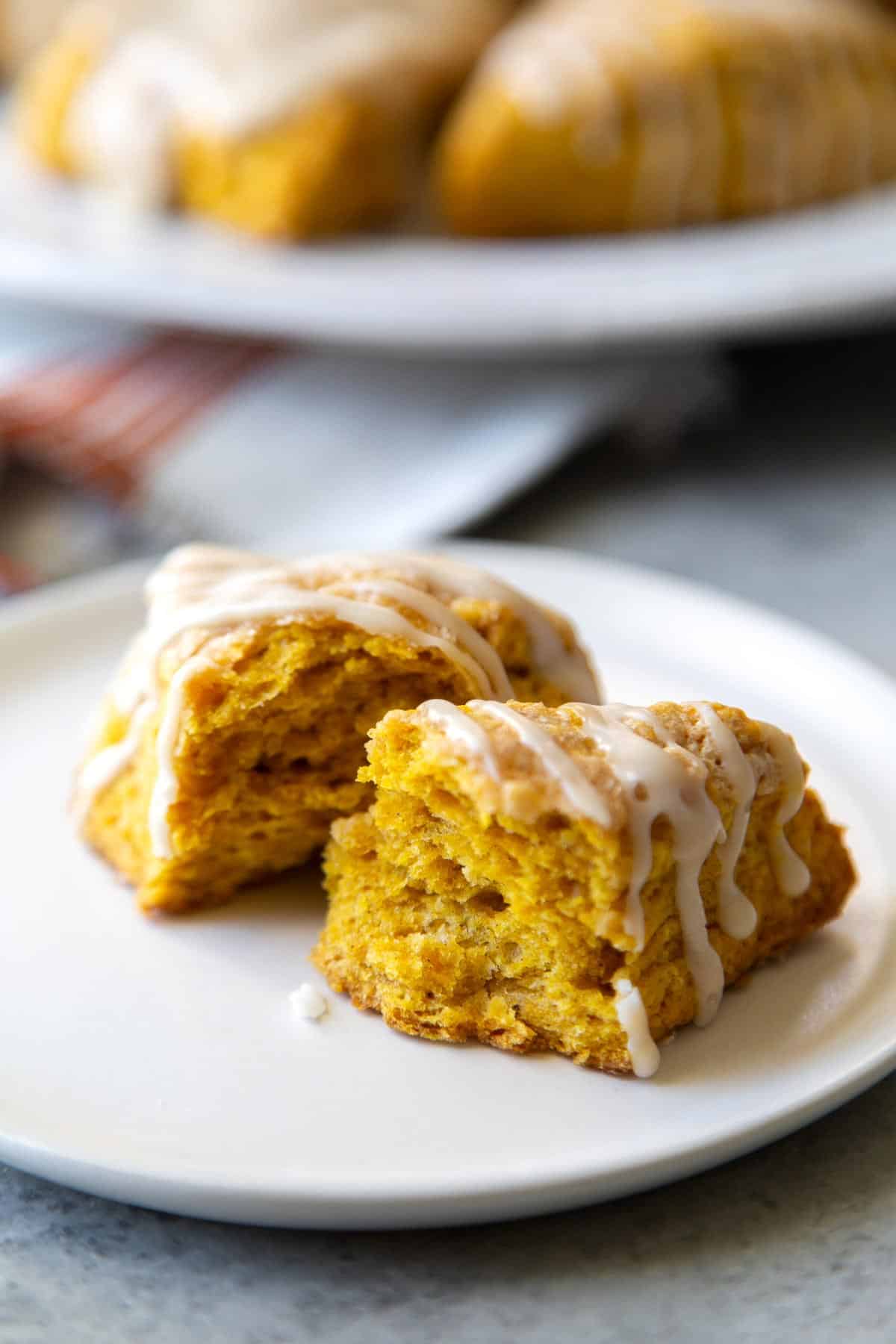 interior shot of pumpkin scone wedge with maple glaze drizzle.