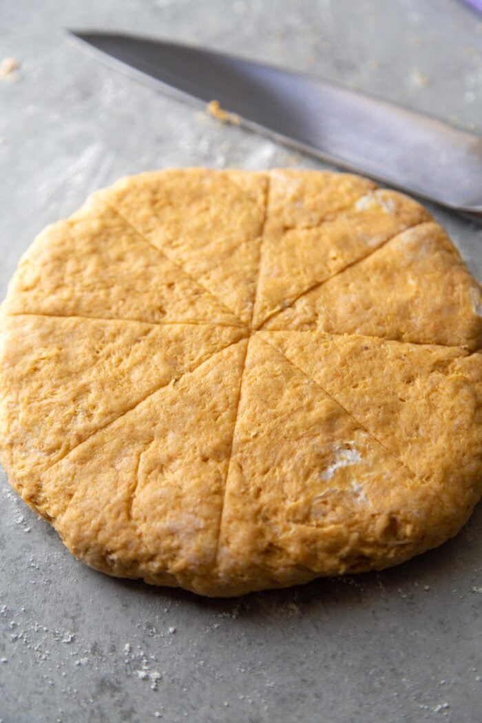 slice 7-inch pumpkin scone round into 8 equal sized wedges.