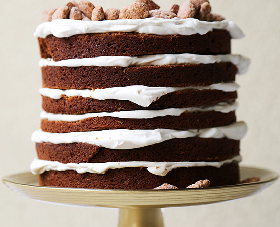 gingerbread layer cake on gold cake stand