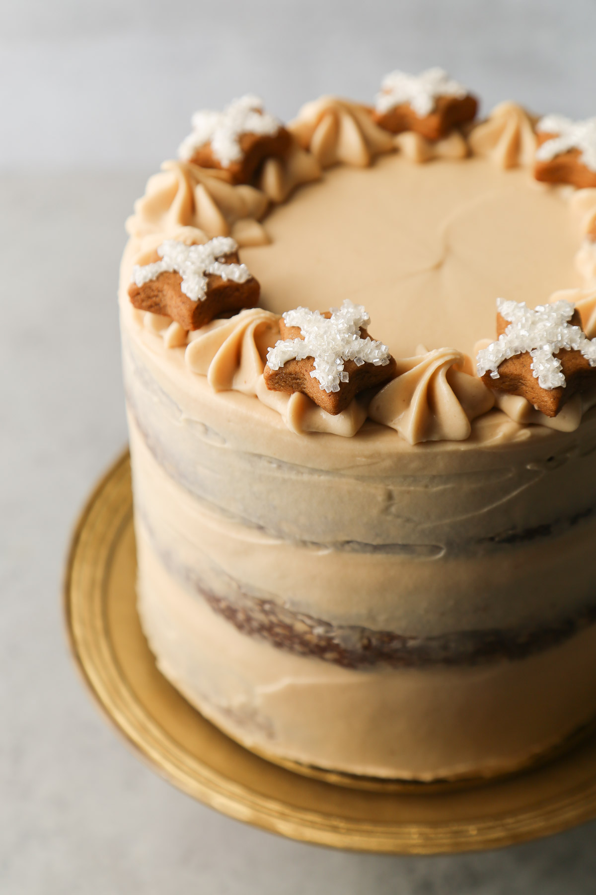 gingerbread layer cake toped with mini gingerbread star cookies.