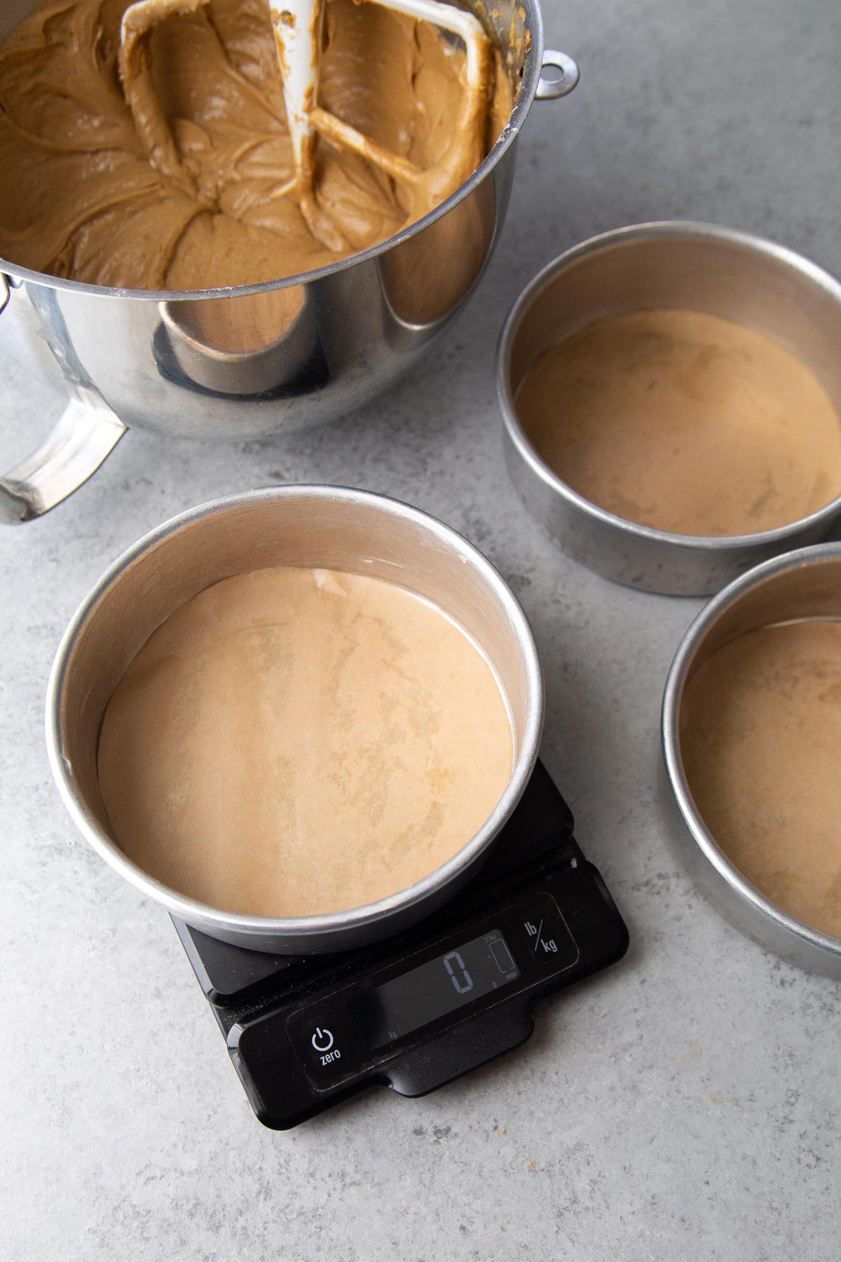 use a kitchen scale to evenly distribute cake batter.