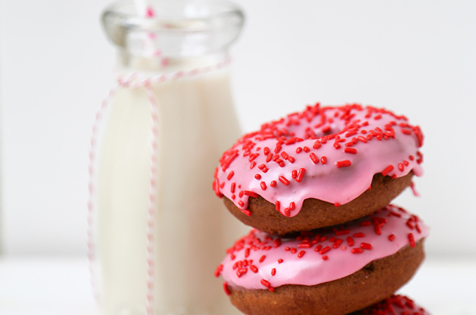 Valentine Cake Doughnuts dipped in pink glaze and topped with red sprinkles