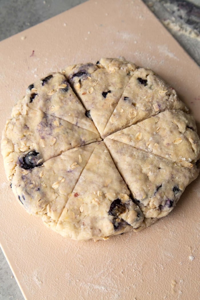 form dough into a circle about 1/2-inch thick and divide into 8 equal wedges.
