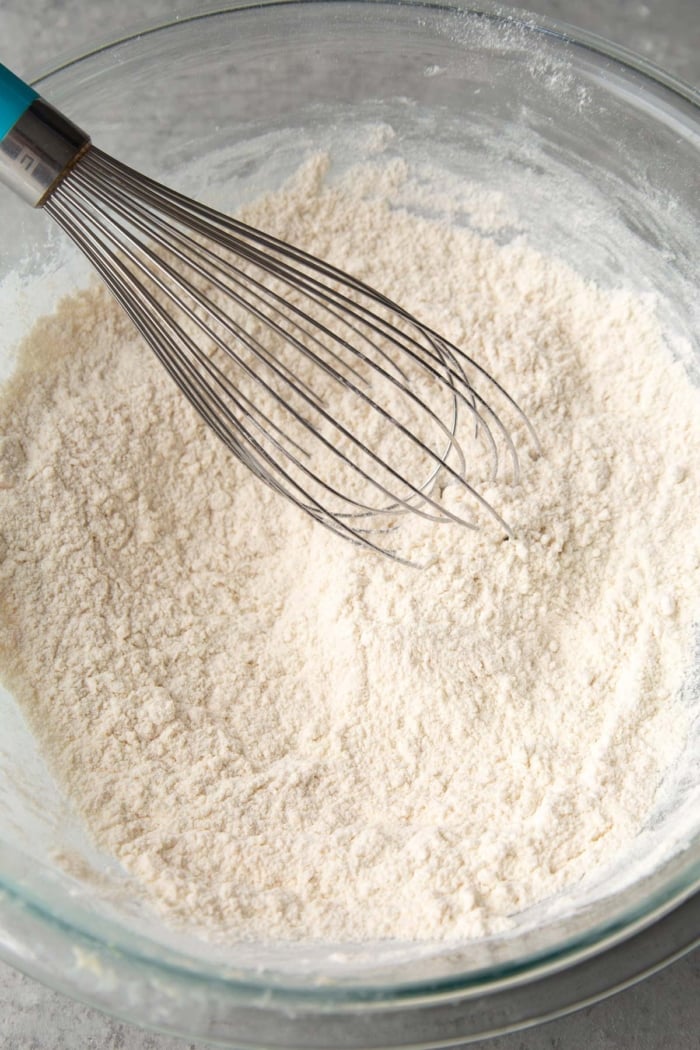 whisk together flour, baking powder, baking soda, salt, sugar, and lemon zest.
