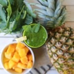 green smoothie featuring mango, pineapple, and baby kale