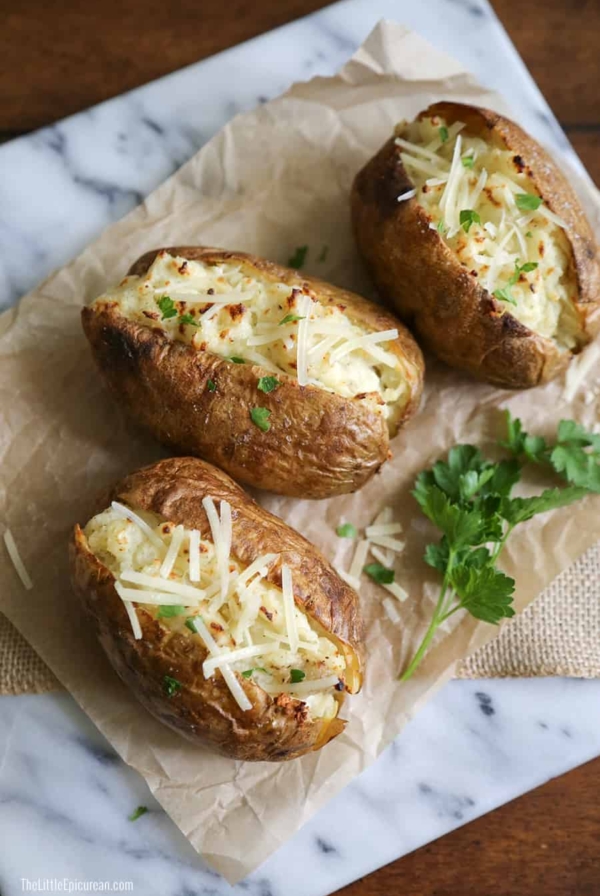 three pieces of twice baked ranch potatoes on marble slab.