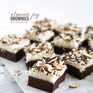 almond joy brownies arranged on parchment paper.