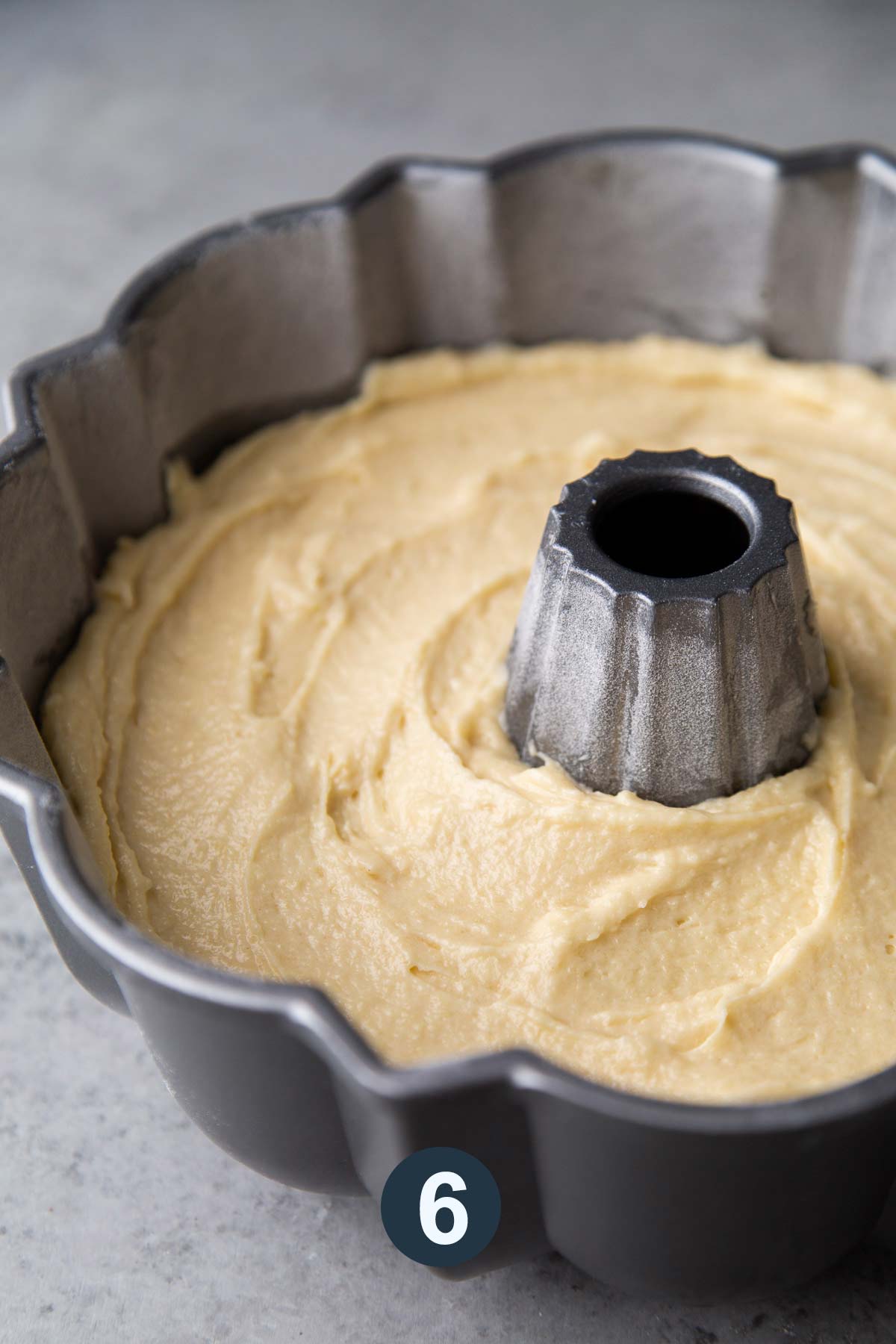 transfer cake batter to prepared bundt cake pan.