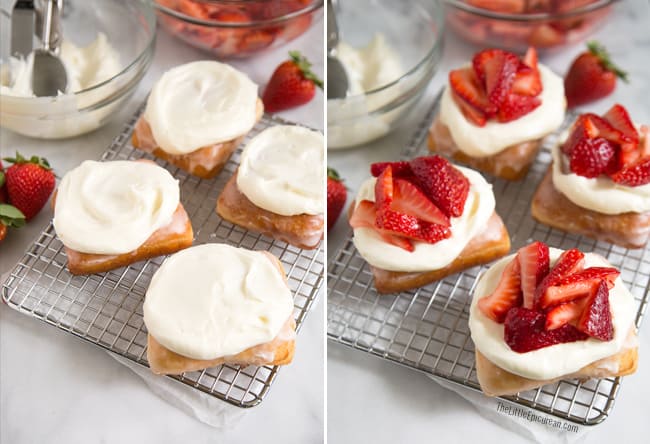 strawberry shortcake donuts with cream cheese frosting and fresh strawberries on wire rack. 