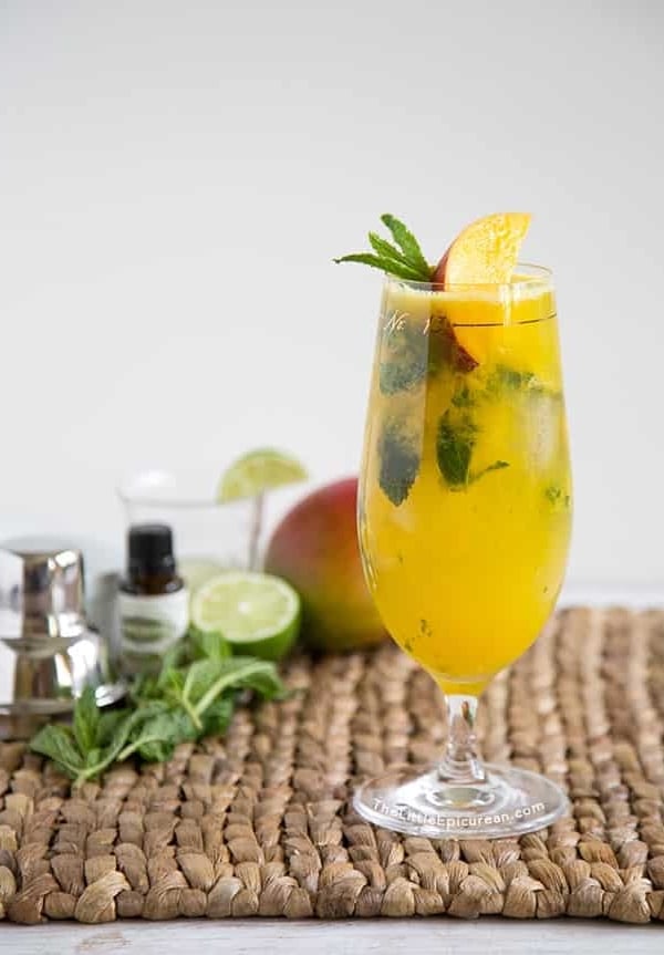 Mango Mojito garnished with fresh mango and mint leaves