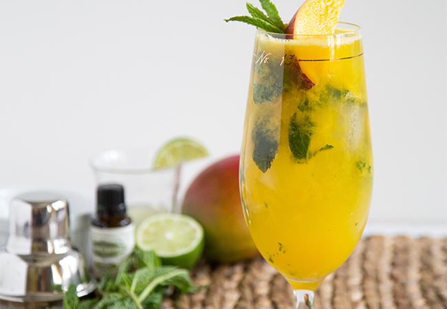 Mango Mojito garnished with fresh mango and mint leaves