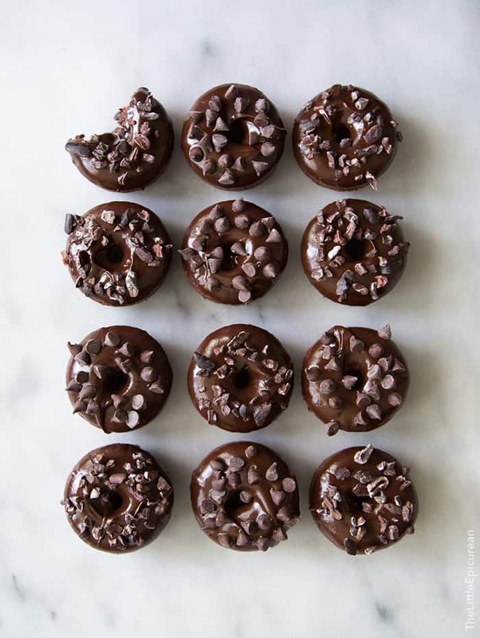 Triple Chocolate Baked Donuts Triple Chocolate Baked Donuts. Baked chocolate donuts dipped in chocolate glaze topped with mini chocolate chip and cacao nibs.