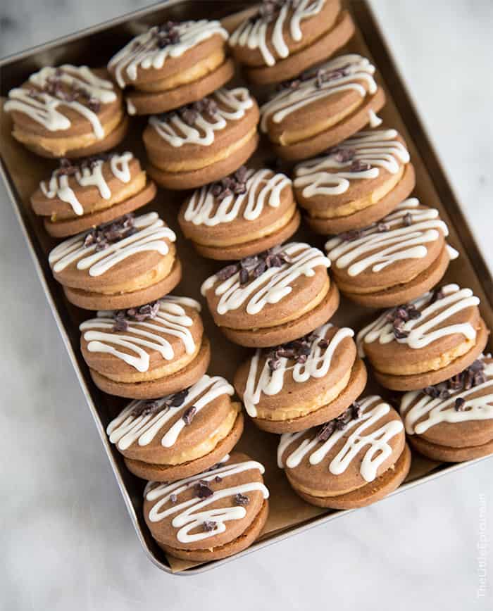 peanut butter filled espresso cookie sandwiches in serving tray. 