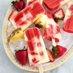 Lava Flow Popsicles made with coconut, pineapple, and strawberry