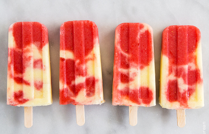 four lava flow frozen pops arranged in a row.