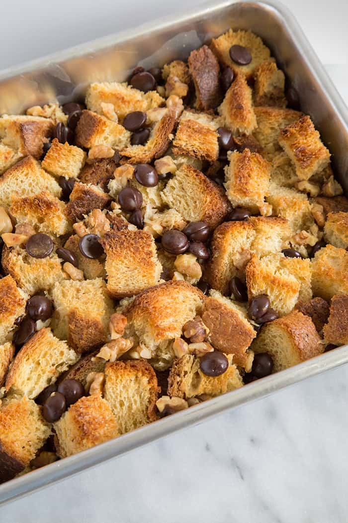 fresh baked walnut chocolate chip bread pudding in casserole pan.