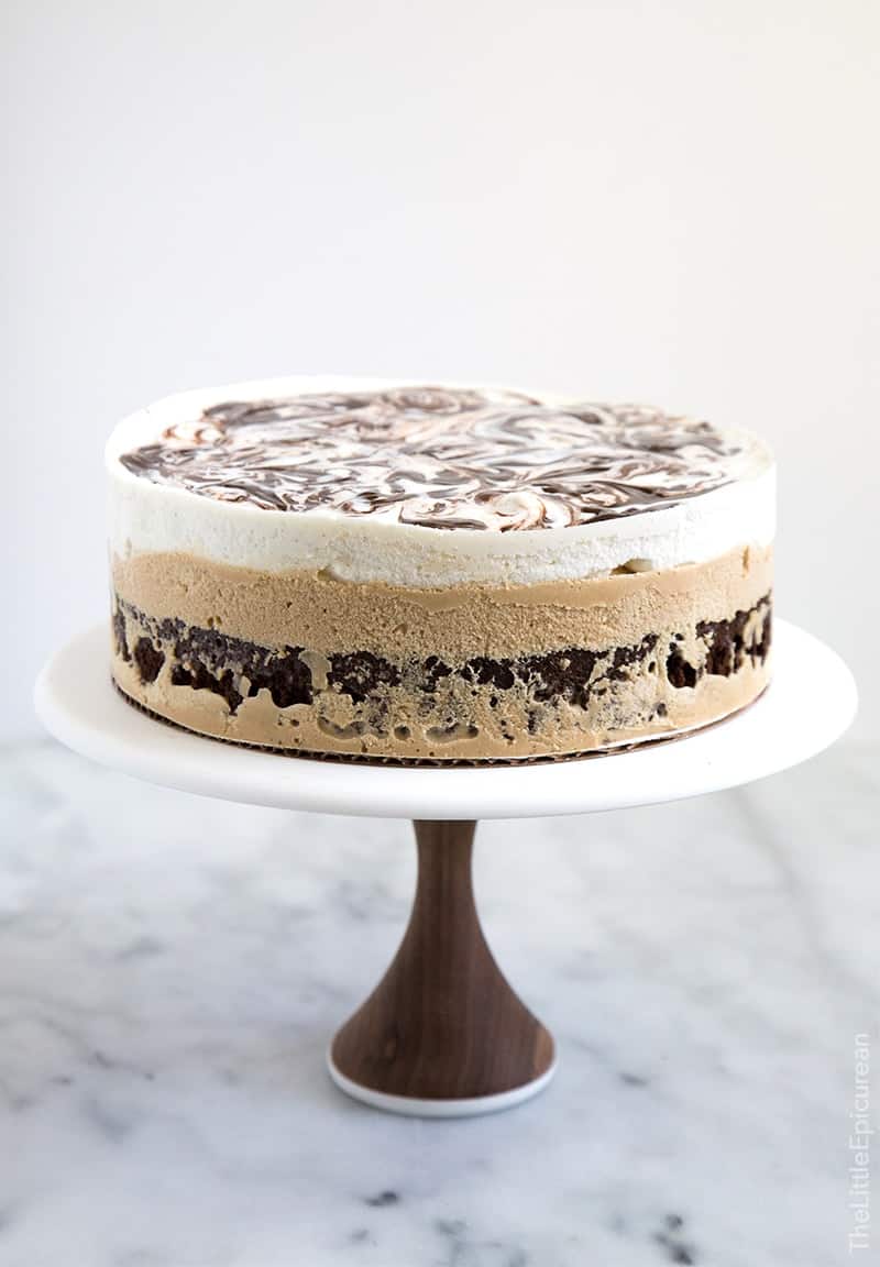 This coffee ice cream cake has a decadent brownie bottom topped with coffee ice cream and a layer of vanilla ice cream swirled with fudge. This ice cream cake takes me back to childhood! 