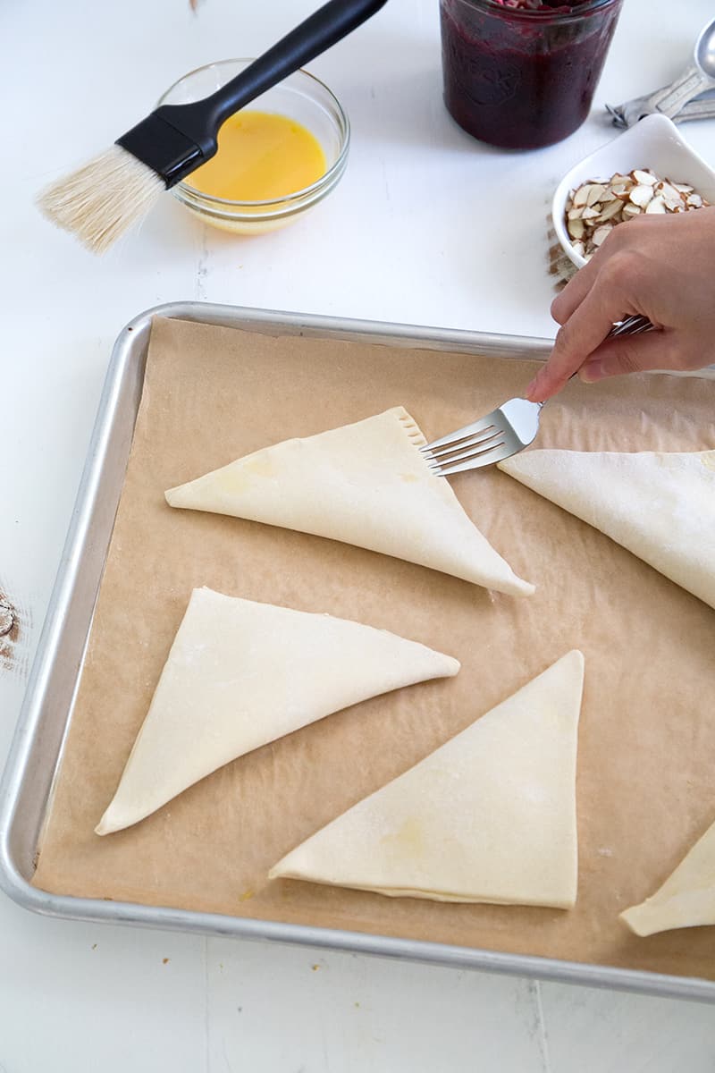 use tines of fork to seal puff pastry turnovers.