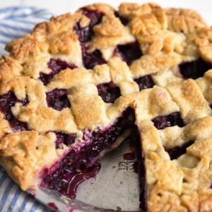 Ginger Blueberry Pie with slice taken out.