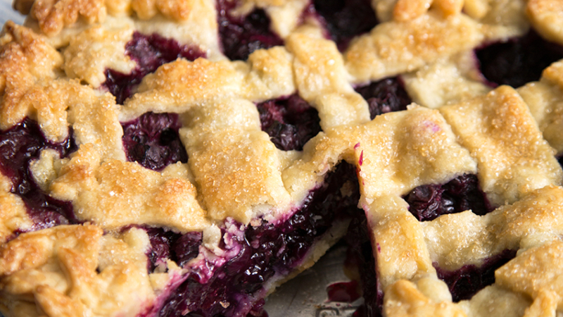 Ginger Blueberry Pie with slice taken out.