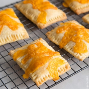 Ham and Cheese Breakfast Tarts on black cooling rack.