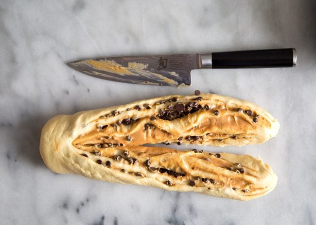 slice log in half to assemble twisted swirl bread.