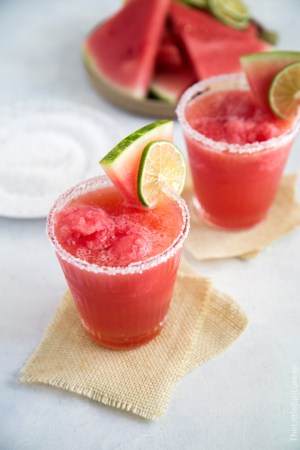Watermelon Margarita Float garnished with watermelon wedge and lime slice.