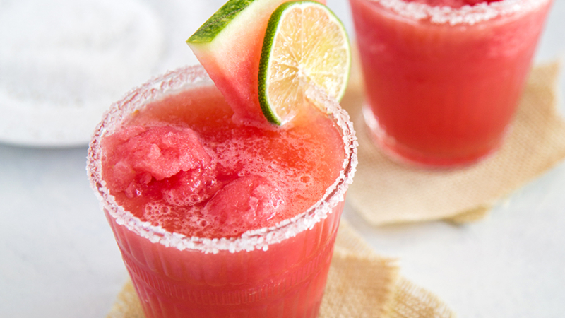 Watermelon Margarita Float garnished with watermelon wedge and lime slice.