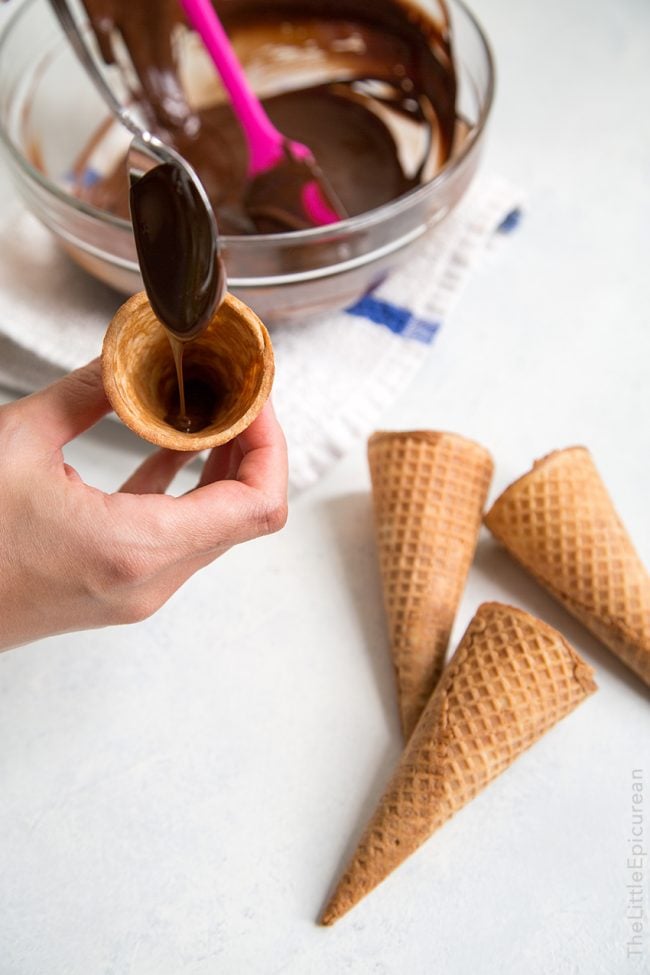 line inside of sugar cones with melted chocolate.