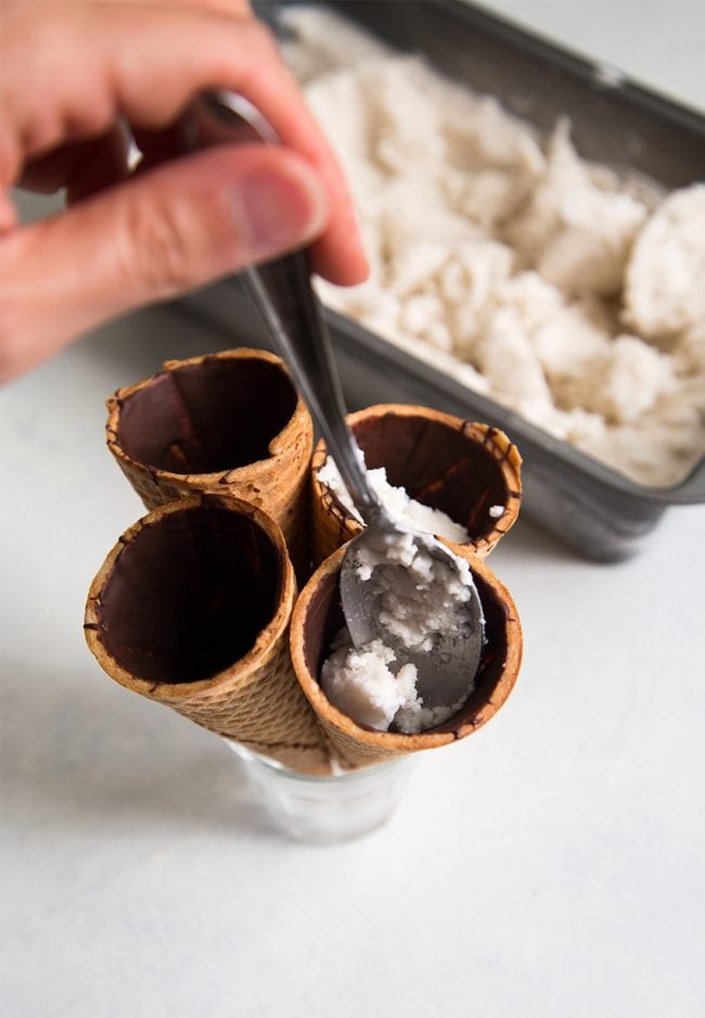 fill chocolate lined sugar cones with homemade coconut ice cream.