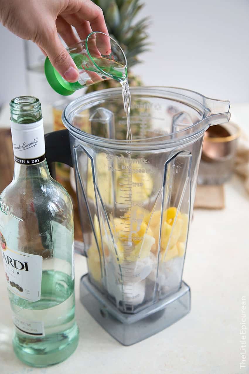 pour rum into blender along with other pina colada ingredients. 