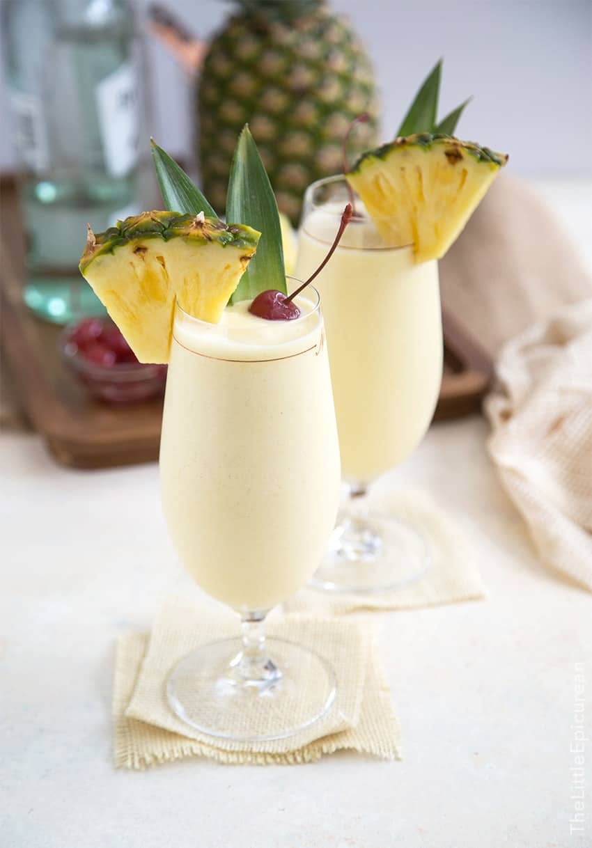 Frozen Pina Colada garnished with pineapple wedge and cherry. 