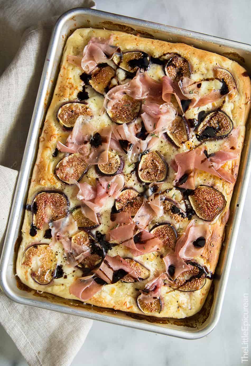 Fig Prosciutto Pizza with Fresh Mozzarella and Balsamic Glaze in quarter sheet pan.