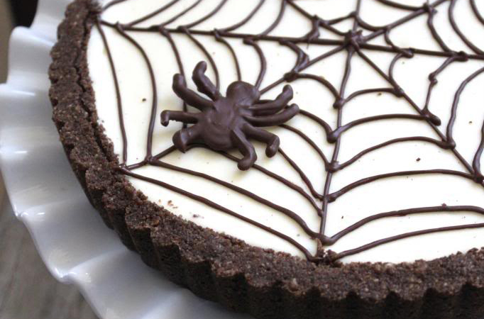 Spider Web Cheesecake Tart on fluted white platter.