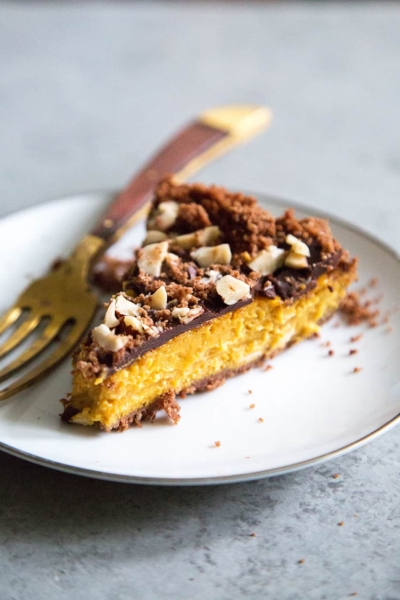 slice of Chocolate Hazelnut Pumpkin Pie on white plate.
