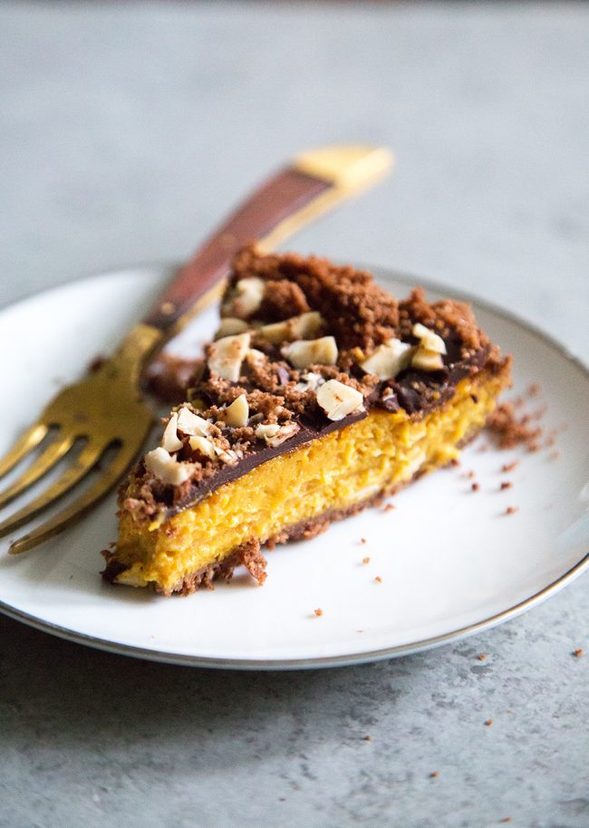 slice of Chocolate Hazelnut Pumpkin Pie on white plate.