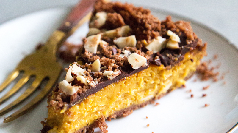 slice of Chocolate Hazelnut Pumpkin Pie on white plate.
