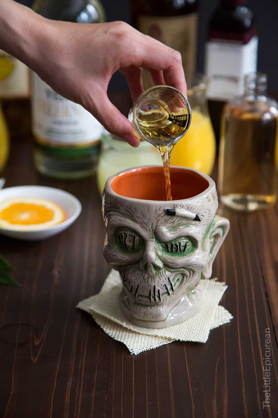 pour rum into zombie cocktail glass. 