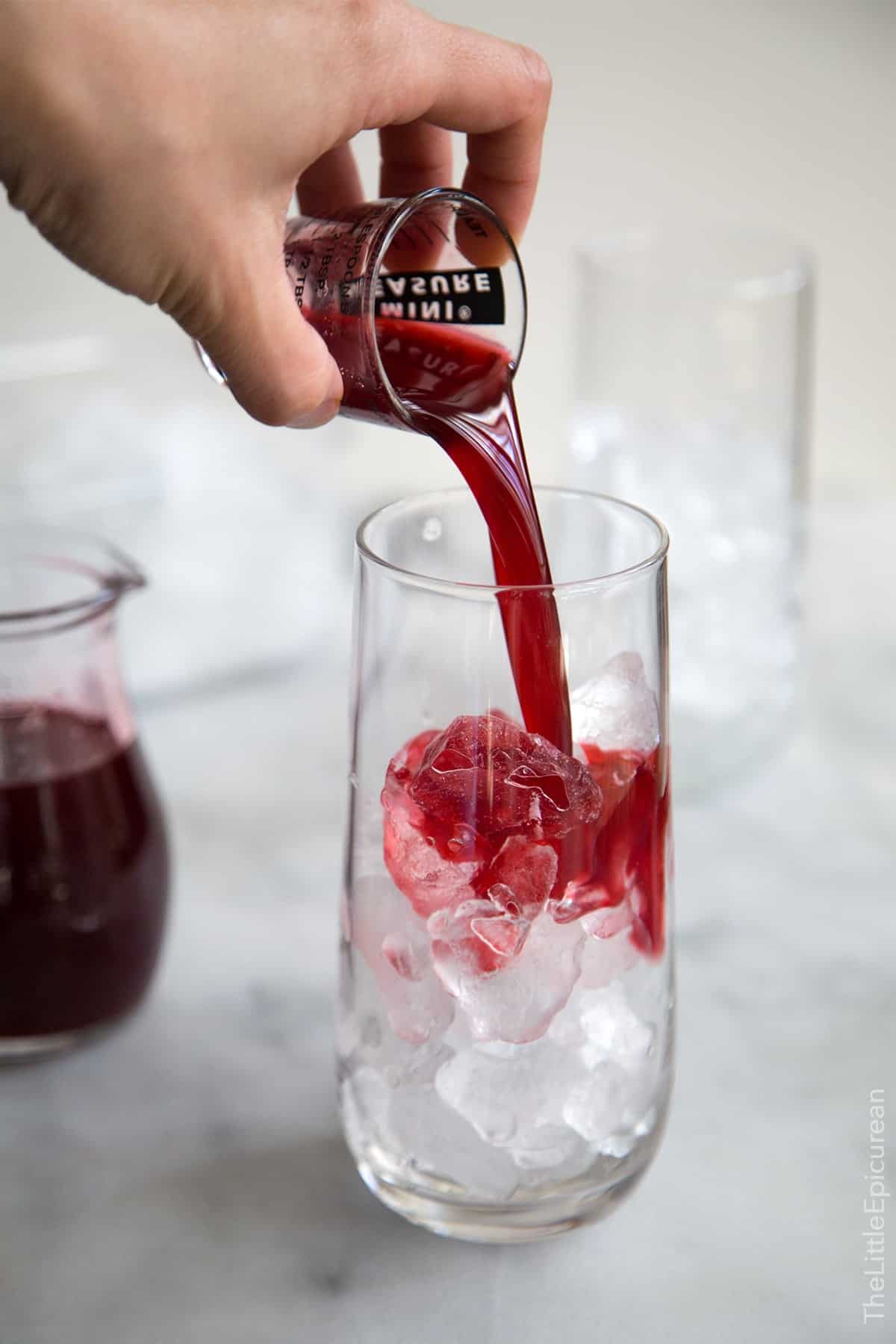 add one ounce blackberry shrub to a serving glass filled with ice. 