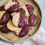 Rose Water Shortbread Cookies on beige plate.