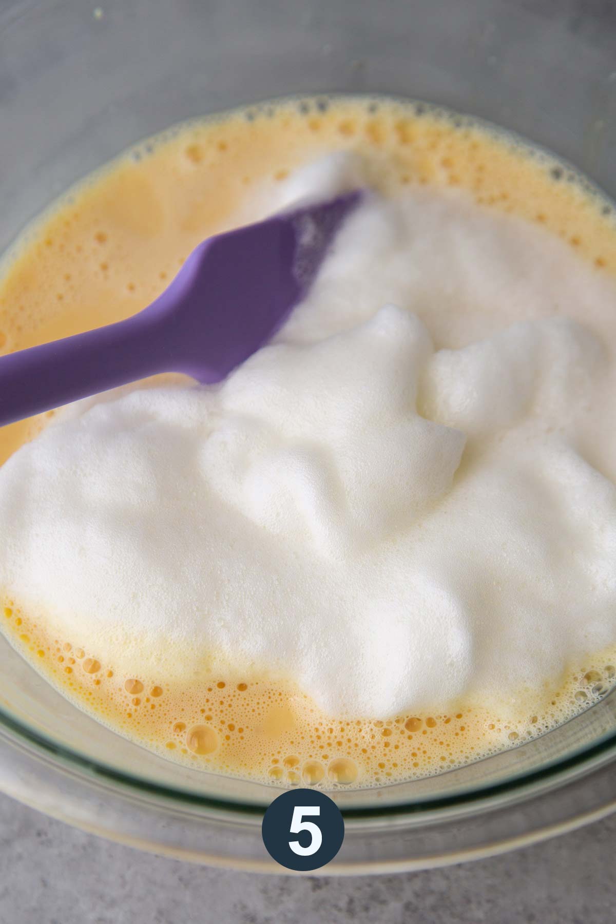 Fold egg whites into wet batter.