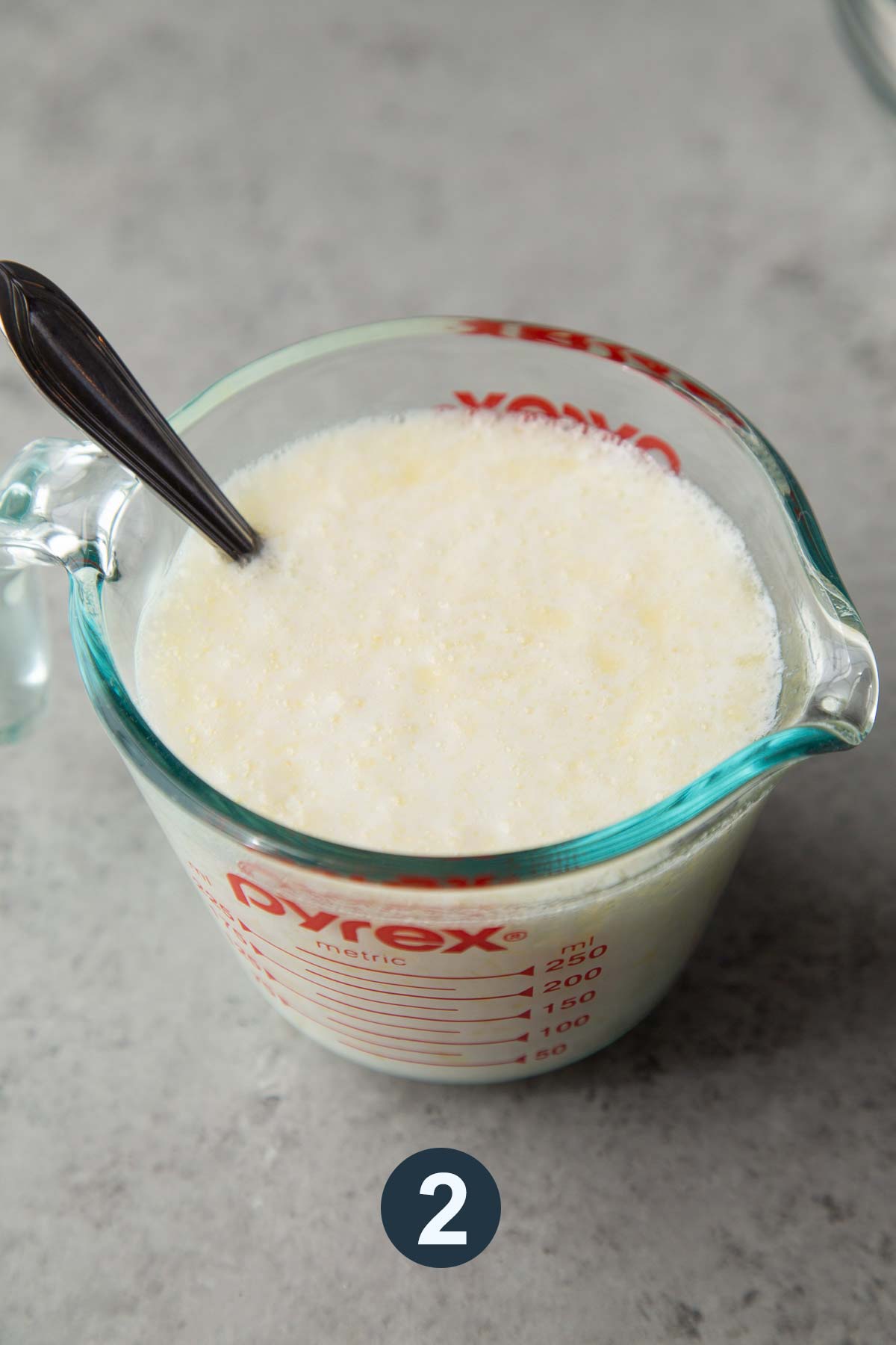 mix together buttermilk, baking soda, and butter in large measuring cup.