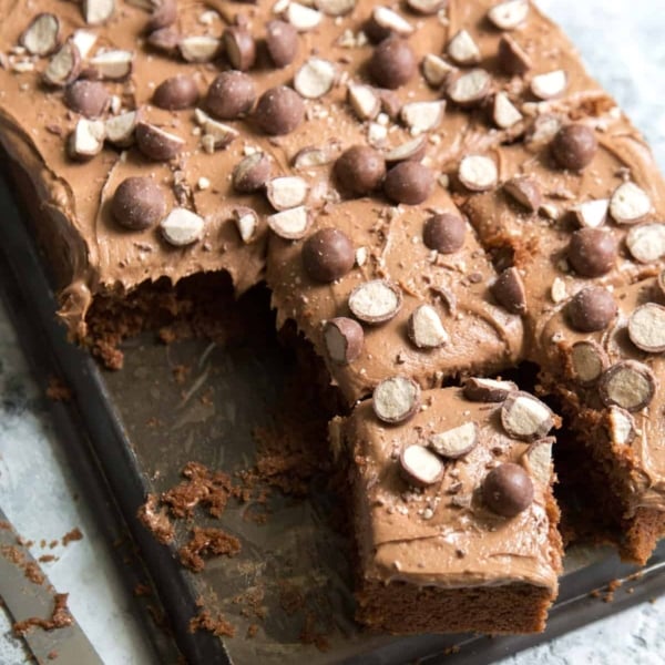 Chocolate Malt Sheet Cake cut into serving portions.