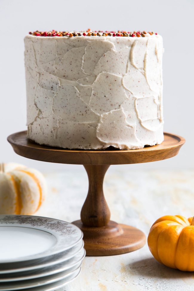 Brown Butter Pumpkin Cake on wooden cake stand.